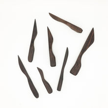 Load image into Gallery viewer, Several Walnut Nifty Spreading Knives of varying sizes ans shapes on white background. 
